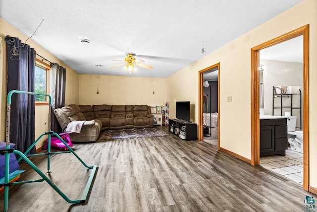 1464 Heather Ln, Cromwell, MN 55726 - living area featuring wood finished floors and ceiling fan