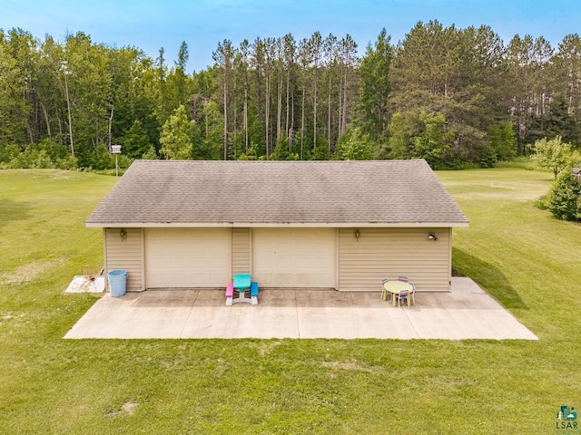 1464 Heather Ln, Cromwell, MN 55726 - detached garage featuring a view of trees