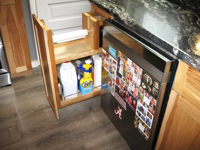 627 4th St, Proctor, MN 55810 - kitchen view of dark wood-type flooring, dark countertops, and dishwashing machine