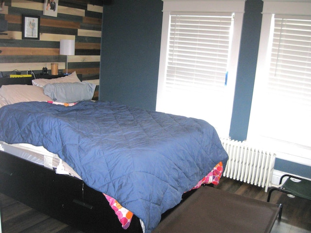 627 4th St, Proctor, MN 55810 - bedroom featuring radiator and wood finished floors