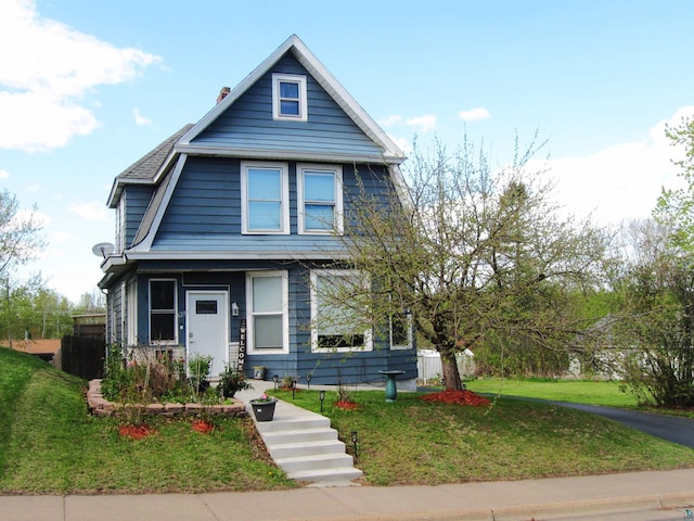 627 4th St, Proctor, MN 55810 - view of front facade with a front lawn