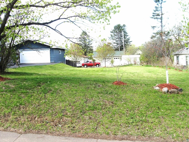627 4th St, Proctor, MN 55810 - view of green lawn with a garage and an outdoor structure
