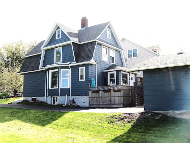 627 4th St, Proctor, MN 55810 - rear view of house with a chimney and roof with shingles