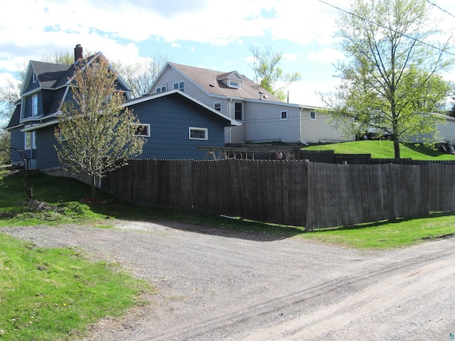 627 4th St, Proctor, MN 55810 - view of home's exterior featuring a chimney