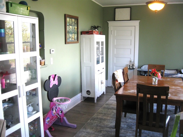627 4th St, Proctor, MN 55810 - dining area with dark wood-type flooring and crown molding
