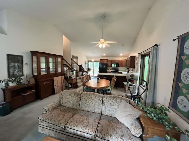 4384 Ugstad Rd, Hermantown, MN 55811 - living area with stairs, ceiling fan, high vaulted ceiling, and light carpet