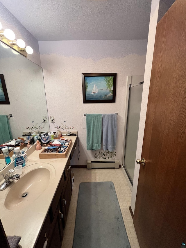 4384 Ugstad Rd, Hermantown, MN 55811 - bathroom featuring baseboard heating, a stall shower, vanity, and a textured ceiling