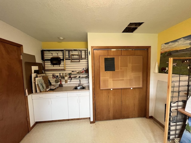 4384 Ugstad Rd, Hermantown, MN 55811 - interior space with white cabinetry, light floors, a textured ceiling, and light countertops