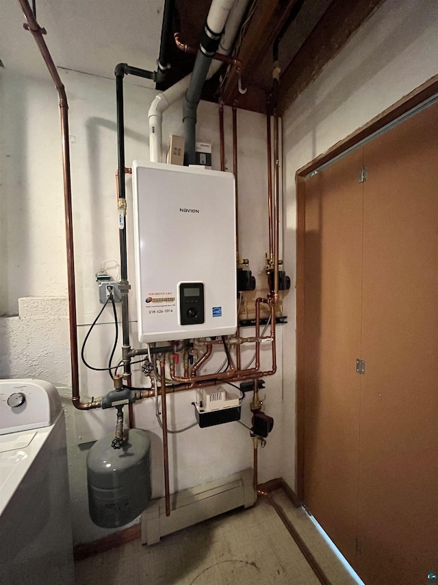 4384 Ugstad Rd, Hermantown, MN 55811 - utility room featuring washer / dryer and tankless water heater