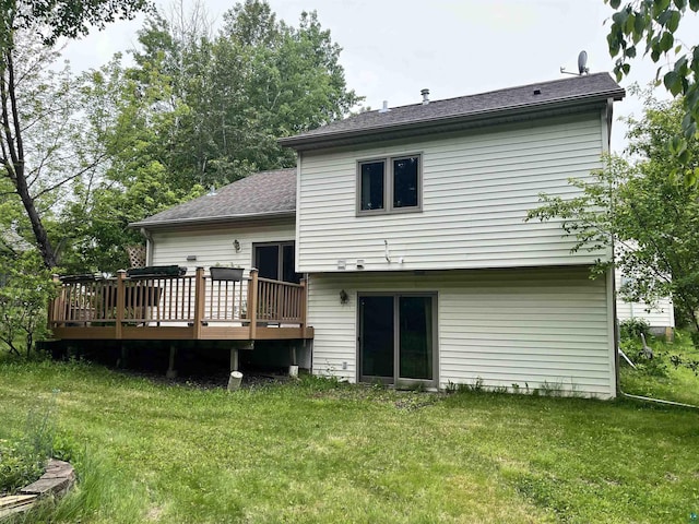 4384 Ugstad Rd, Hermantown, MN 55811 - rear view of house featuring a deck, a yard, and a shingled roof
