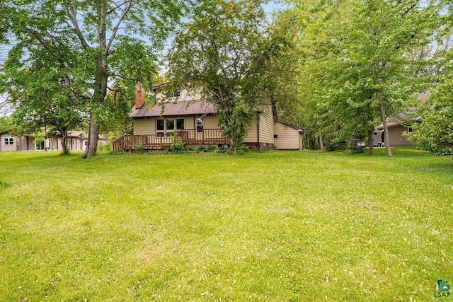 4724 E Ayers Rd, Saginaw, MN 55779 - view of green lawn with a wooden deck