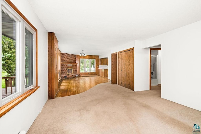 4724 E Ayers Rd, Saginaw, MN 55779 - living area featuring carpet, a chandelier, and a fireplace