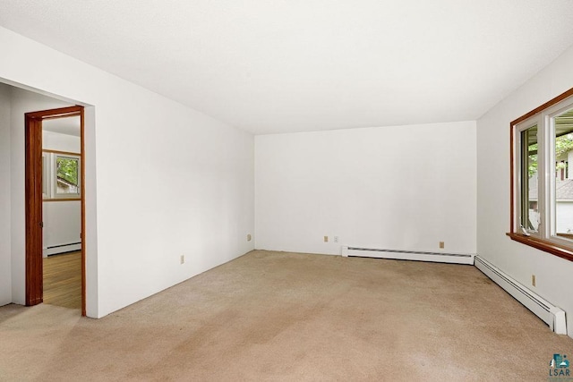 4724 E Ayers Rd, Saginaw, MN 55779 - empty room with carpet floors and a baseboard heating unit