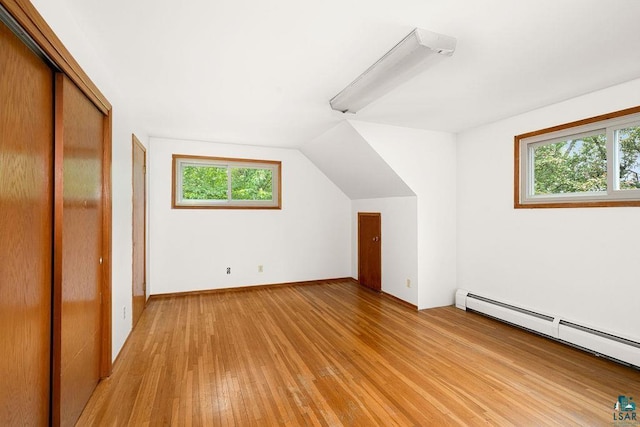 4724 E Ayers Rd, Saginaw, MN 55779 - bonus room with a baseboard radiator, light wood-style flooring, and vaulted ceiling