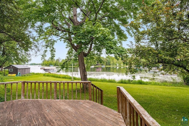 4724 E Ayers Rd, Saginaw, MN 55779 - wooden deck featuring a water view, a yard, and a storage unit