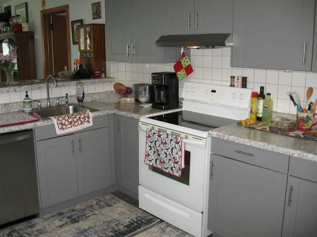 421 E Chapman St, Ely, MN 55731 - kitchen featuring electric range, stainless steel dishwasher, ventilation hood, gray cabinetry, and decorative backsplash