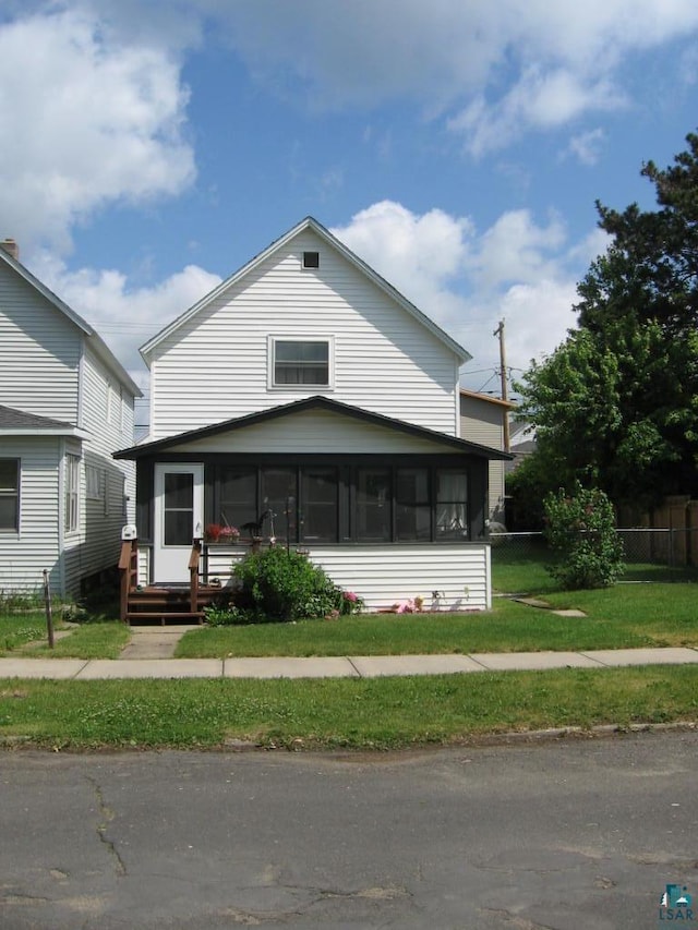 421 E Chapman St, Ely, MN 55731 - view of front of home featuring a sunroom