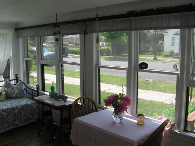 421 E Chapman St, Ely, MN 55731 - dining space featuring ornamental molding and wood finished floors