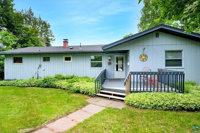 4284 Turner Rd, Duluth, MN 55803 - ranch-style home with a chimney, a front lawn, a wooden deck, and roof with shingles