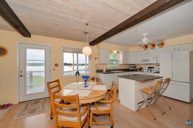 4284 Turner Rd, Duluth, MN 55803 - dining space featuring light wood-type flooring, ceiling fan, and a wood ceiling with exposed beams