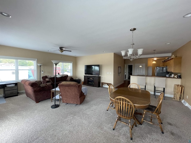 126 W Bayfield St Unit 204, Washburn, WI 54891 - carpeted dining area with a chandelier and ceiling fan