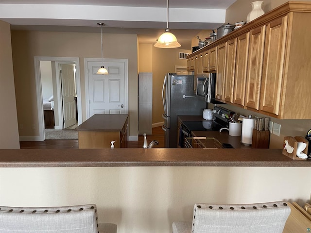 126 W Bayfield St Unit 204, Washburn, WI 54891 - kitchen featuring electric range oven, stainless steel microwave, a kitchen island, dark countertops, and decorative light fixtures