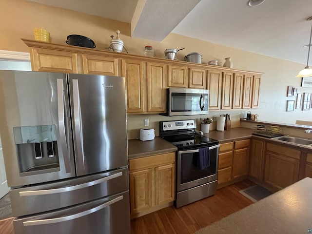 126 W Bayfield St Unit 204, Washburn, WI 54891 - kitchen featuring appliances with stainless steel finishes, dark wood-style floors, decorative light fixtures, a peninsula, and dark countertops