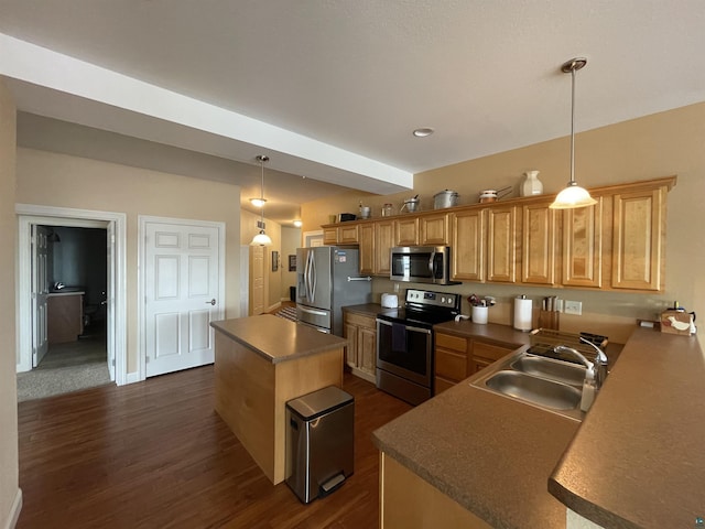 126 W Bayfield St Unit 204, Washburn, WI 54891 - kitchen featuring stainless steel appliances, a kitchen island, dark wood-style floors, and dark countertops