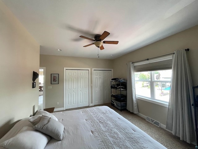 126 W Bayfield St Unit 204, Washburn, WI 54891 - carpeted bedroom featuring two closets and ceiling fan