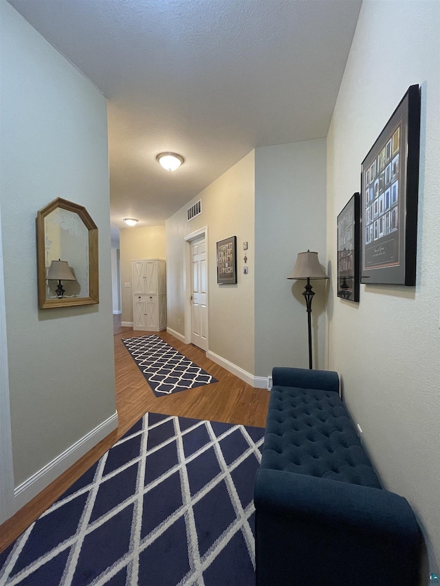 126 W Bayfield St Unit 204, Washburn, WI 54891 - hall with wood finished floors and baseboards