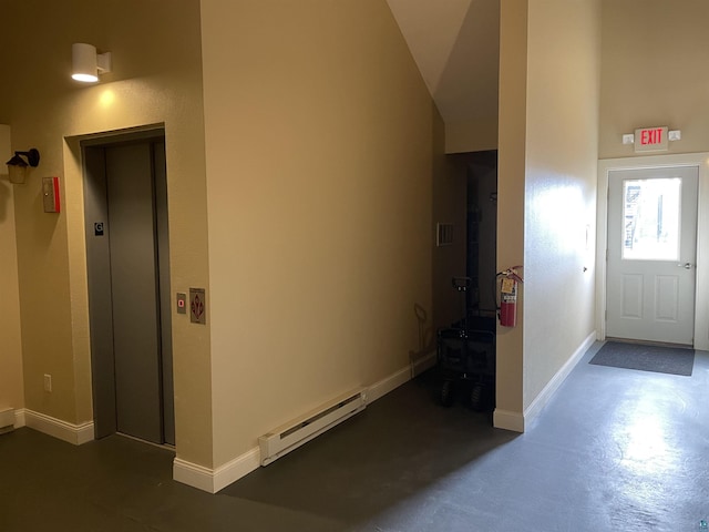 126 W Bayfield St Unit 204, Washburn, WI 54891 - foyer featuring a baseboard radiator, finished concrete floors, and elevator