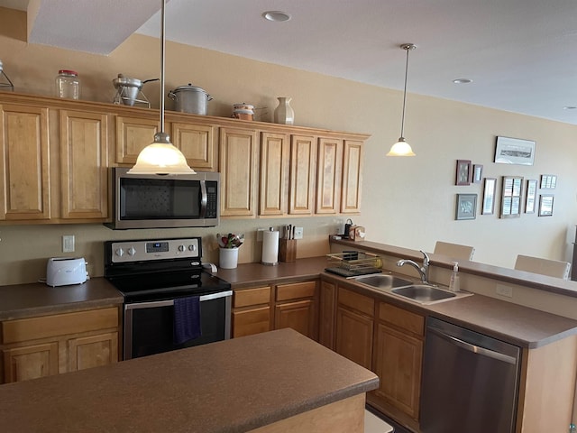 126 W Bayfield St Unit 204, Washburn, WI 54891 - kitchen featuring stainless steel appliances, a peninsula, dark countertops, decorative light fixtures, and recessed lighting