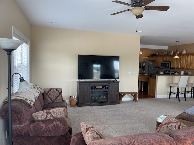 126 W Bayfield St Unit 204, Washburn, WI 54891 - carpeted living room featuring a ceiling fan and baseboards