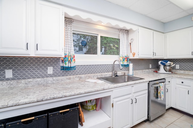 324 W Wabasha St, Duluth, MN 55803 - kitchen featuring dishwasher, tasteful backsplash, light countertops, and white cabinetry
