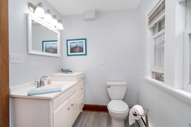 324 W Wabasha St, Duluth, MN 55803 - half bathroom with vanity and wood finished floors