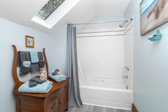 324 W Wabasha St, Duluth, MN 55803 - full bathroom with a skylight, shower / tub combo with curtain, wood finished floors, and lofted ceiling