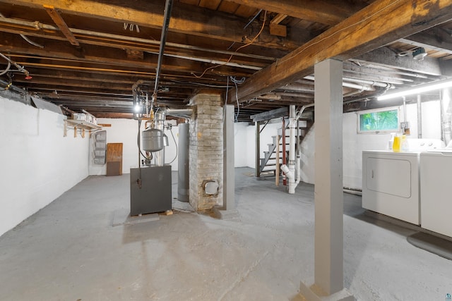 324 W Wabasha St, Duluth, MN 55803 - below grade area with washing machine and clothes dryer, water heater, stairs, and a heating unit