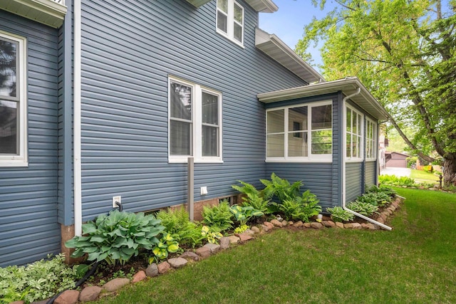 324 W Wabasha St, Duluth, MN 55803 - view of side of home featuring a yard and a sunroom