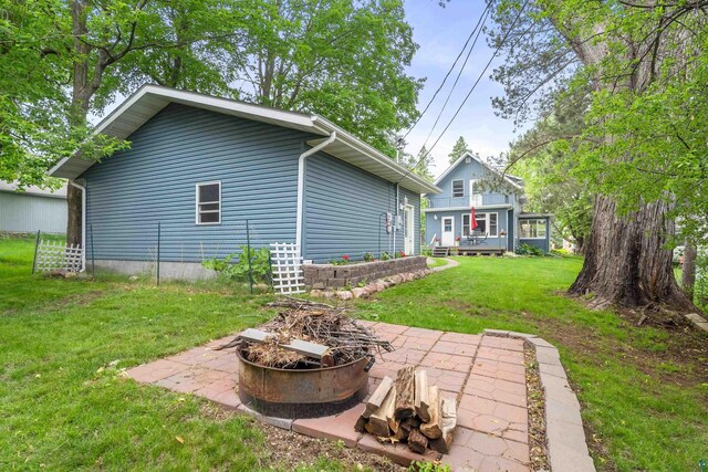 324 W Wabasha St, Duluth, MN 55803 - rear view of house featuring a fire pit, a yard, and a patio