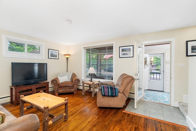 324 W Wabasha St, Duluth, MN 55803 - living room featuring a baseboard heating unit and wood finished floors