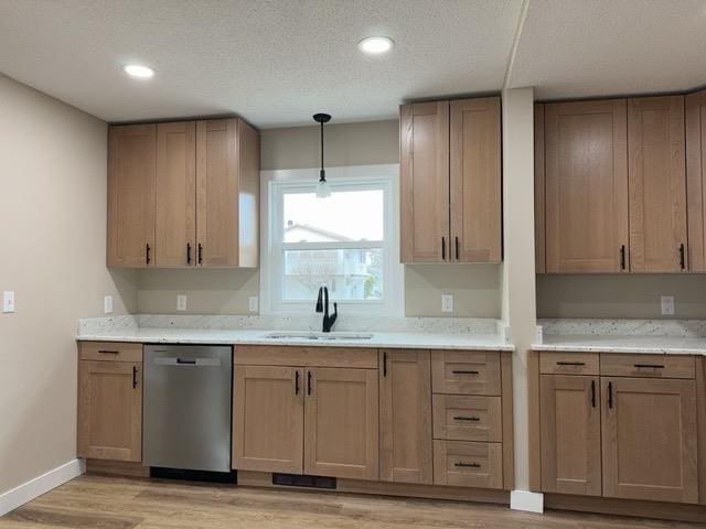20 S Erie St, Aurora, MN 55705 - kitchen featuring dishwasher, light wood finished floors, decorative light fixtures, recessed lighting, and a textured ceiling
