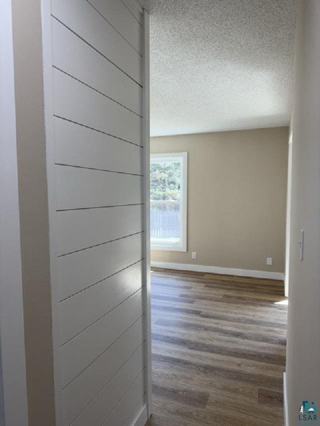 20 S Erie St, Aurora, MN 55705 - corridor featuring a textured ceiling and wood finished floors