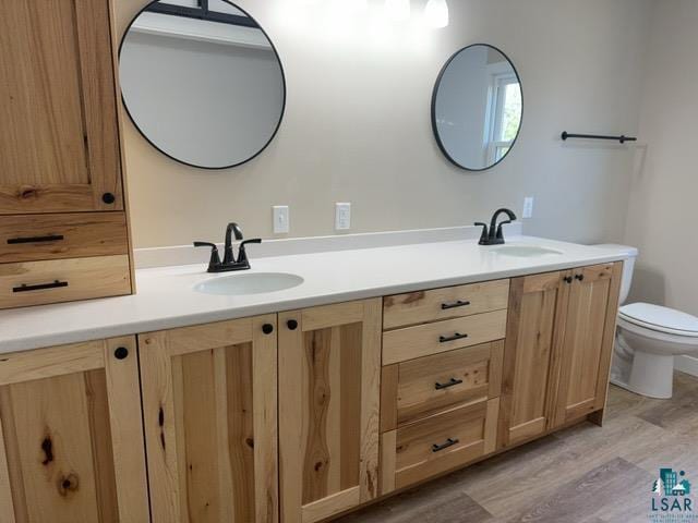 20 S Erie St, Aurora, MN 55705 - full bathroom with double vanity and wood finished floors