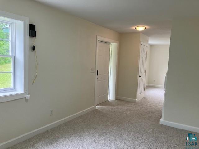 34358 State Highway 18, Finlayson, MN 55735 - spare room featuring healthy amount of natural light and carpet