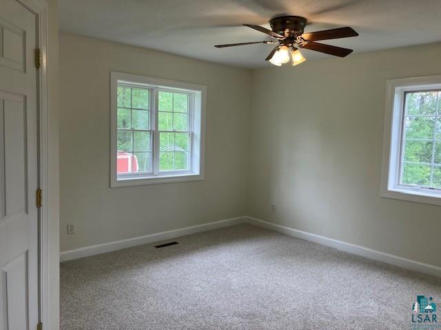 34358 State Highway 18, Finlayson, MN 55735 - carpeted spare room with ceiling fan and baseboards