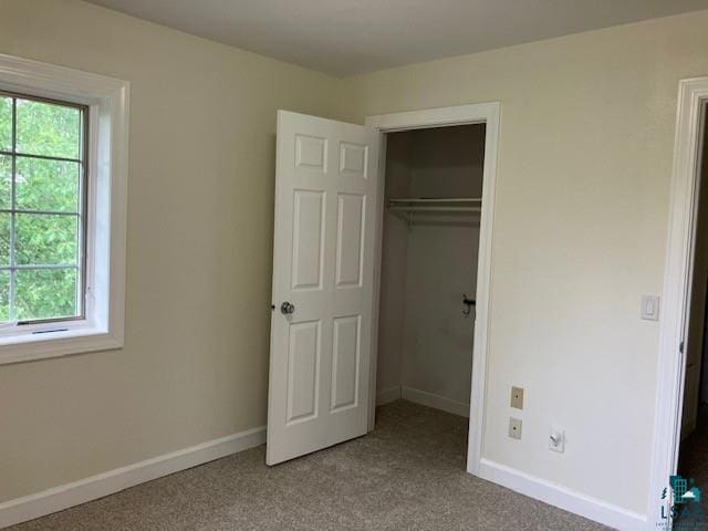 34358 State Highway 18, Finlayson, MN 55735 - unfurnished bedroom featuring multiple windows, carpet flooring, and a closet