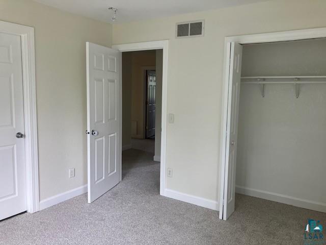 34358 State Highway 18, Finlayson, MN 55735 - unfurnished bedroom featuring carpet floors and a closet