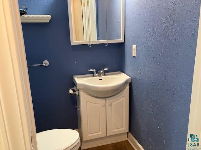 34358 State Highway 18, Finlayson, MN 55735 - bathroom featuring toilet and vanity