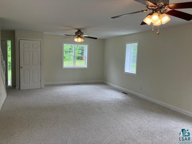 34358 State Highway 18, Finlayson, MN 55735 - empty room featuring healthy amount of natural light, ceiling fan, and carpet flooring
