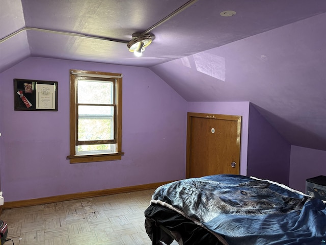 403 E Camp St, Ely, MN 55731 - bedroom with vaulted ceiling and baseboards